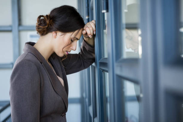 istock Tired businesswoman in office 698410716