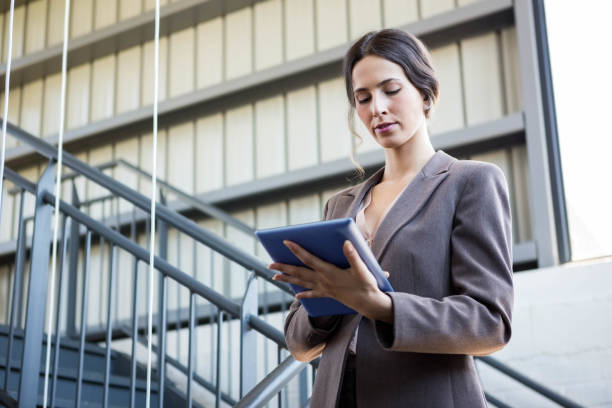 istock Beautiful businesswoman using digital tablet 698411356