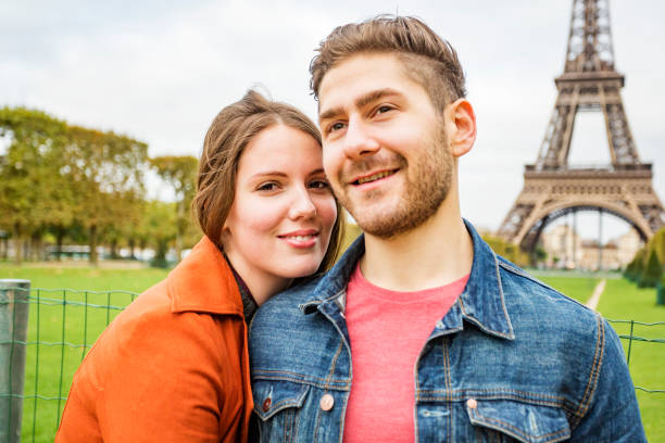 istock Romantic Young Couple With The Eiffel Tower in Paris 698421650