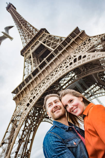 istock Romantic Young Couple With The Eiffel Tower in Paris 698421672