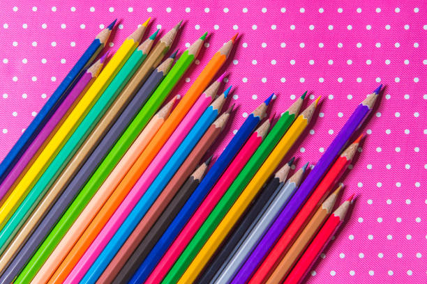 istock Color pencils isolated on Pink fabric background 698429322