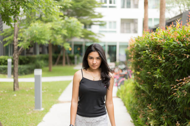 A pretty female student takes a break on campusClick on the banner below to see more photos like this.