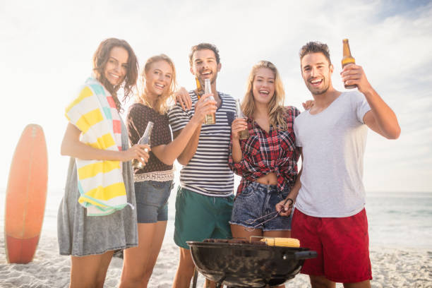 istock Happy friends having fun around barbecue 698444566
