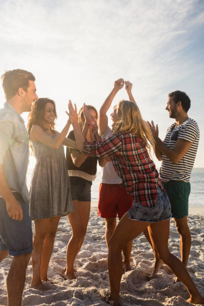 istock Happy friends dancing together 698450668