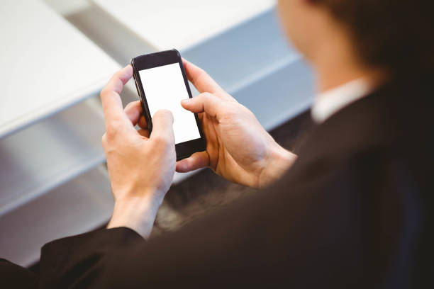 istock Businessman text messaging on smartphone 698450914