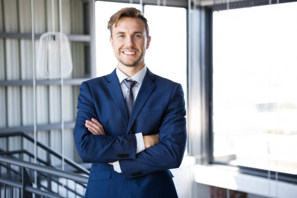 istock Businessman standing with arms crossed 698450922
