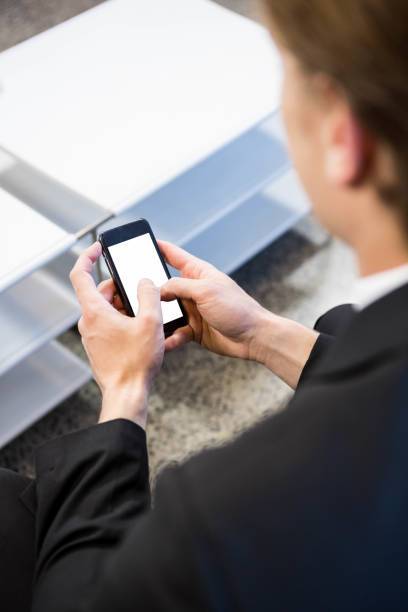 istock Businessman text messaging on smartphone 698451046