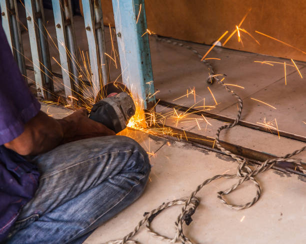 cutting steel with steel cutting tools causes sparking. - vehicle door flash imagens e fotografias de stock