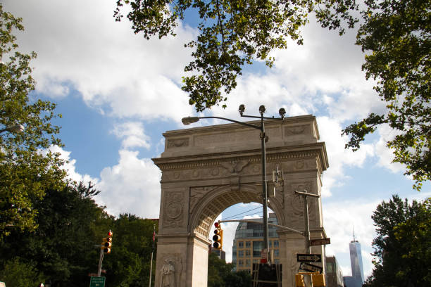 istock Washington square arch with trees and traffic light, New York 698466534