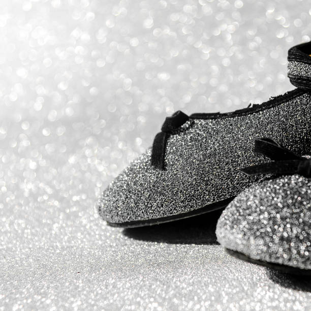 istock Black and white ballet shoes with glitter background. 698467014