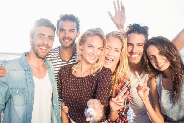 istock Happy friends taking selfie 698475544
