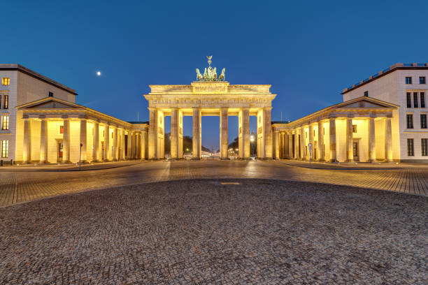 istock The famous Brandenburg Gate in Berlin illuminated at dawn 698476442