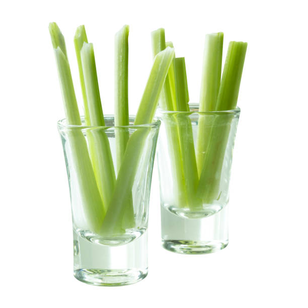istock Green celery stick slice  in shot glass 698495906