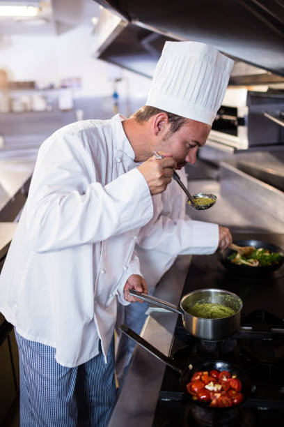 istock Chef smelling food in the kitchen 698508012