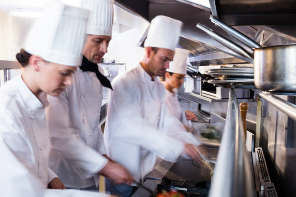 istock Chefs preparing food in the kitchen 698508514