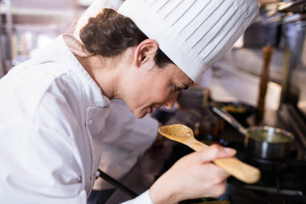 istock Chef smelling food in the kitchen 698508846