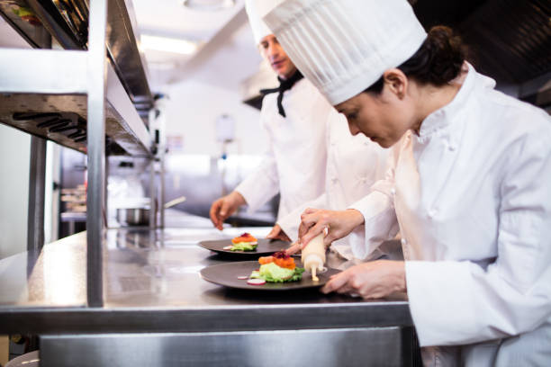 istock Chef decorating a food plate 698509470