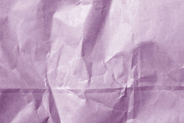 istock wrinckled violet color paper surface. 698515386