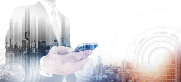 istock Double exposure businessman using smartphone and city in sunrise, with white copy space 698520298