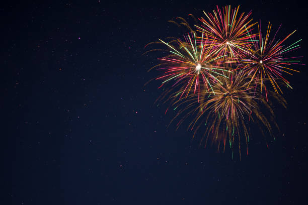istock Golden red green fireworks over night sky 698520368