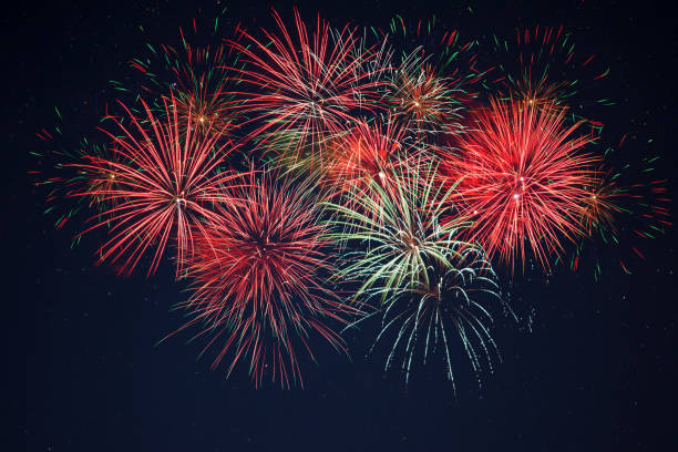 istock Sparkling red green yellow fireworks over starry sky 698520370