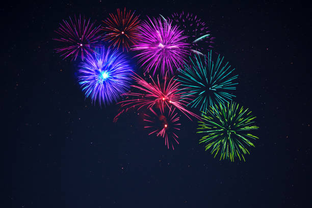 istock Pink purpe blue green fireworks over starry sky 698520404