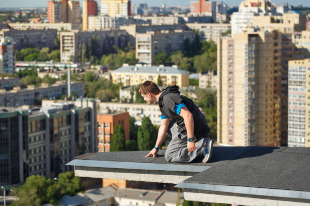 istock Roofer at the edge of the roof 698529270