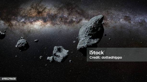 A Swarm Of Asteroids In Front Of The Milky Way Galaxy Stock Photo - Download Image Now