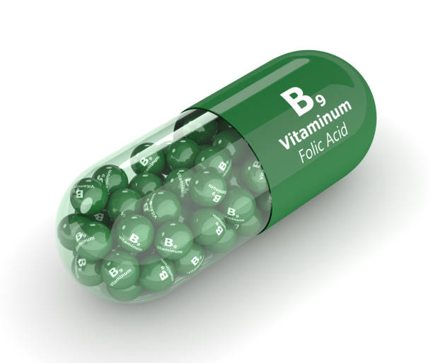 istock 3d render of B9 folic acid pill with granules 698530514