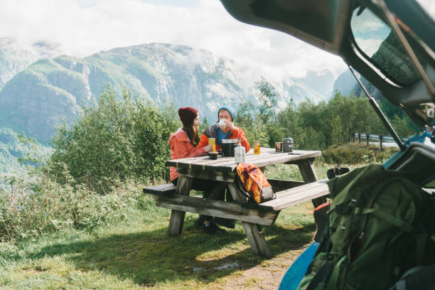 Couple have breakfast in mountains in Norway