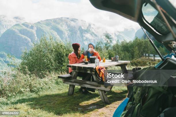 Couple Have Breakfast In Mountains In Norway Stock Photo - Download Image Now - Car, Picnic, Norway