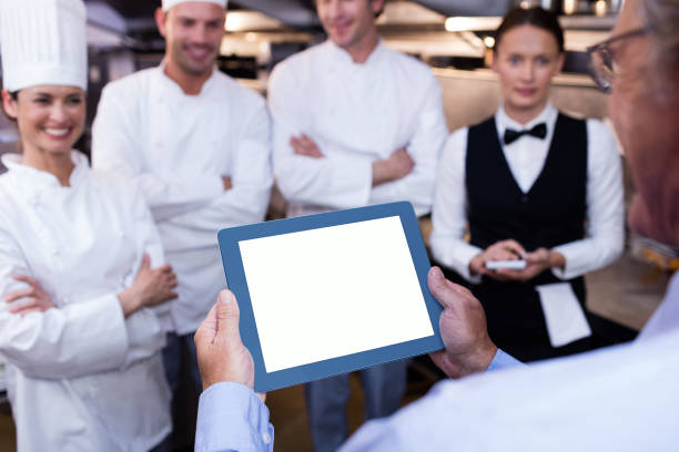 istock Restaurant manager briefing to his kitchen staff 698542274
