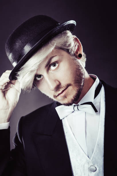 istock Elegantly dressed man wearing black fedora hat 698542294