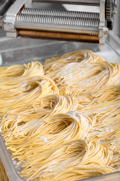 istock Bundles of freshly made Italian spaghetti pasta 698542454