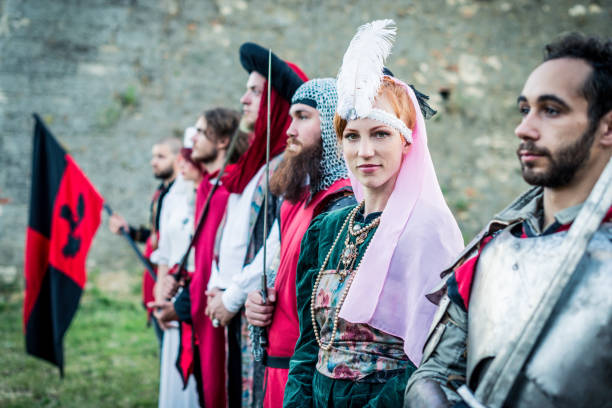 Beautiful medieval princess from fourteenth century with her servants