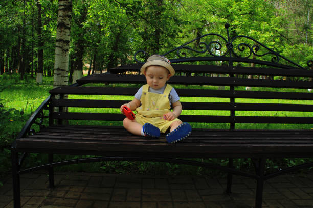 istock Child, baby, boy walks in the park. 698545328