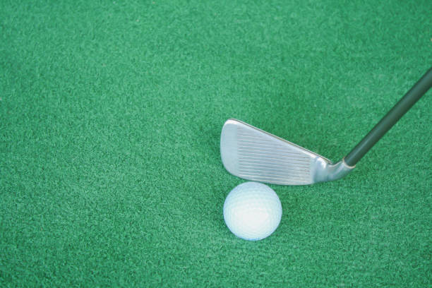 istock Golf clubs and golf balls on green artificial grass At the golf driving range 698557242
