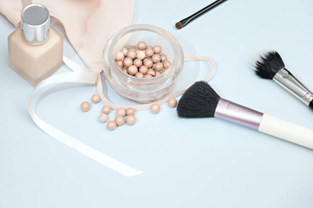 istock Frame from set of professional decorative cosmetics, makeup tools and accessory on blue background copy space for your text. flat lay frame composition, top view 698557324