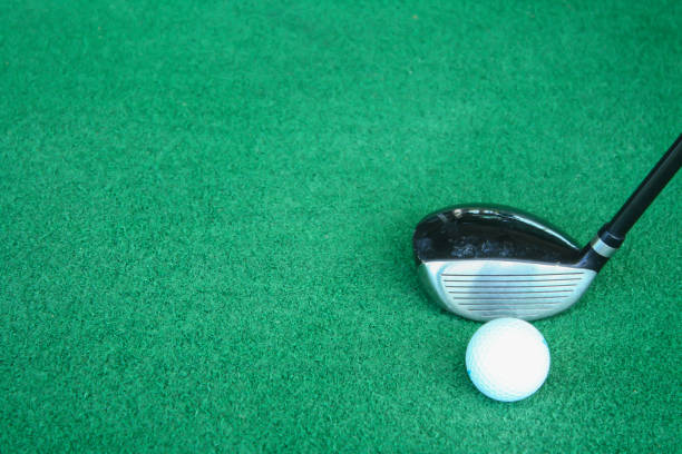 istock Golf clubs and golf balls on green artificial grass At the golf driving range 698557884