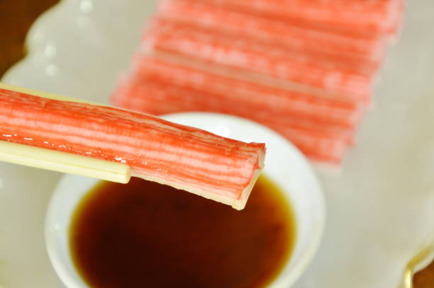 istock imitation crab stick made from fish dipping with soy sauce 698560872