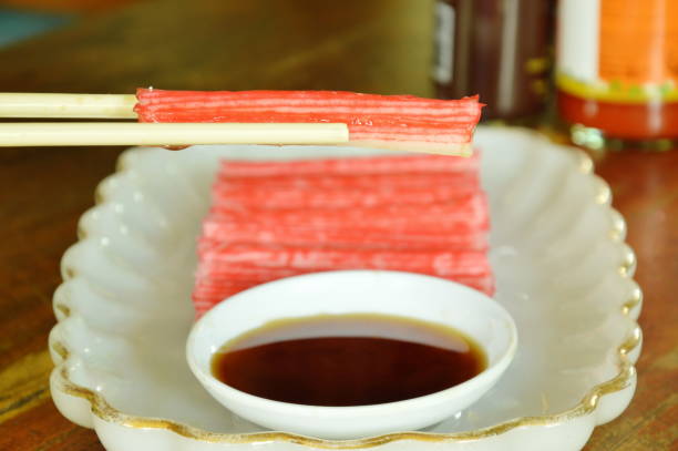 istock imitation crab stick made from fish dipping with soy sauce 698563052