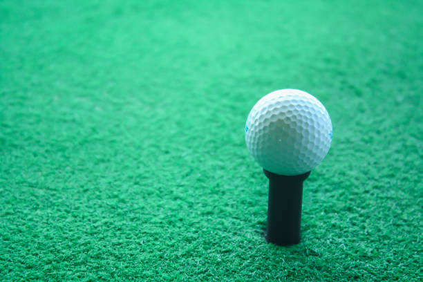 istock Golf ball on tee ready to be shot at a drivingrange 698563944