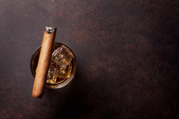 istock Whiskey with ice and cigar 698569130