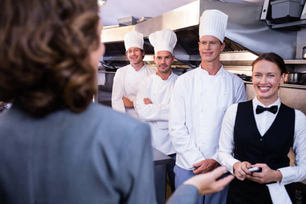 istock Restaurant manager briefing to his kitchen staff 698582062