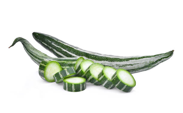 istock fresh snake gourd isolated on white background 698582120