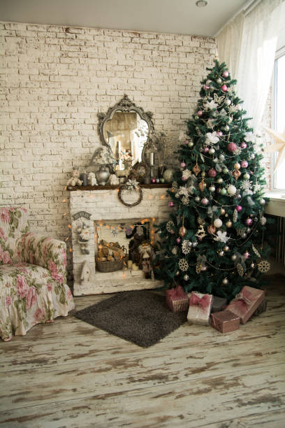 istock Christmas tree and fireplace with an armchair 698586366