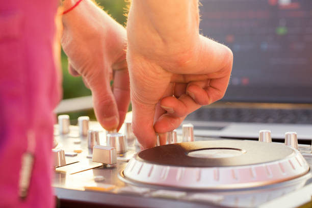 istock Dj mixing music outdoor. 698590152