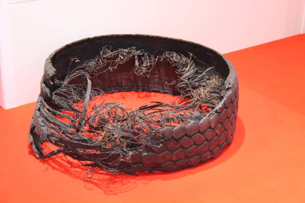 Old car tires. Collection of old wheels. Landfill details. Rubber waste.