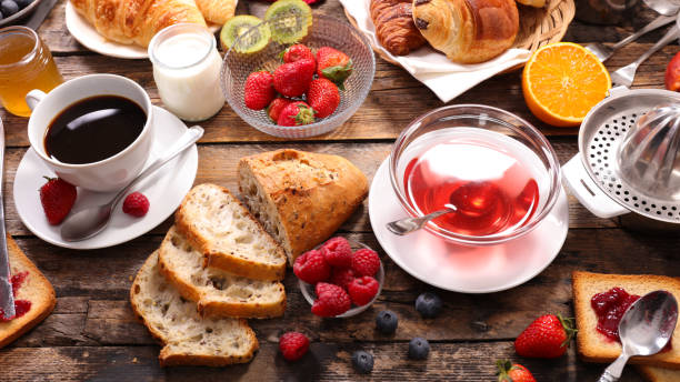 istock breakfast with coffee,croissant and fruits 698591320