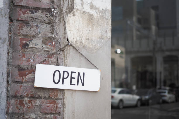 istock Open sign in street cafe 698594654